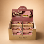 Display box of Palm Bites Dubai chocolate bars on a beige background