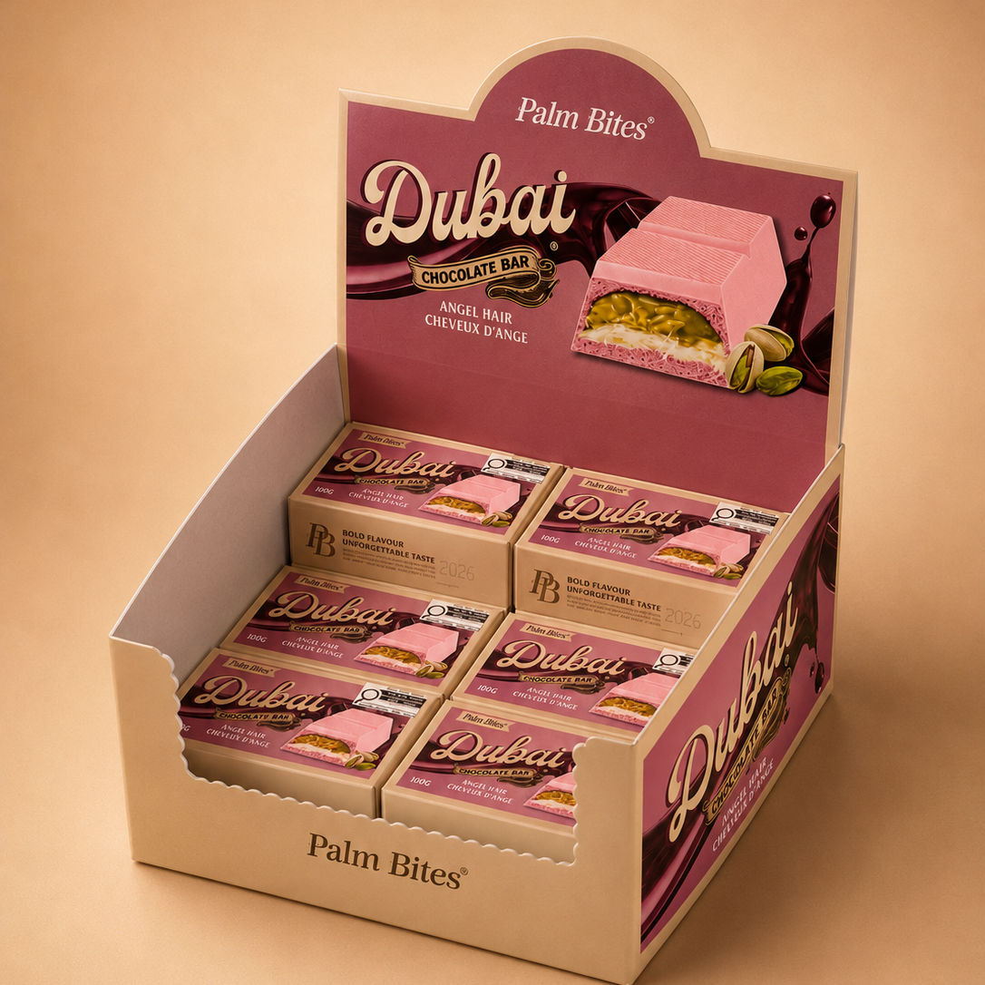 Display box of Palm Bites Dubai chocolate bars on a beige background